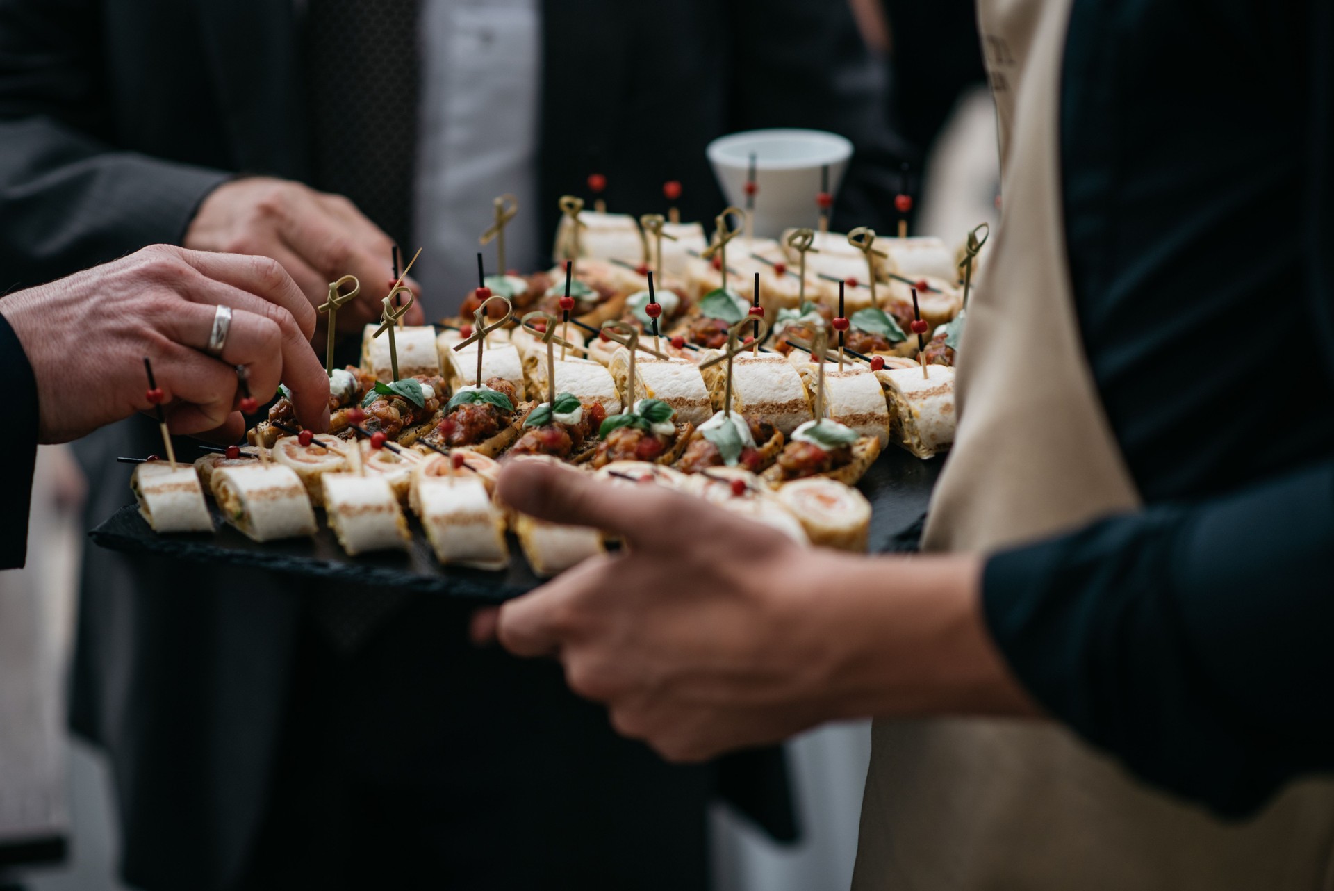 Waiter Serving Gourmet Appetizers At Luxury Wedding Reception